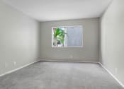 Thumbnail 58 of 61 - an empty room with a window with a plant in it