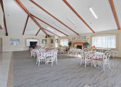 Thumbnail 48 of 52 - a dining room with tables and chairs and a fireplace