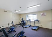 Thumbnail 51 of 52 - a workout room with exercise equipment at the village