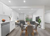 Thumbnail 21 of 52 - a living room and dining room with a table and chairs