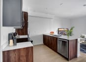 Thumbnail 17 of 83 - a kitchen with a large island and a stainless steel dishwasher