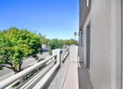 Thumbnail 34 of 62 - the view from the balcony of a large apartment building overlooking a city street