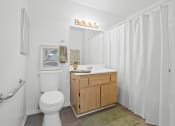 Thumbnail 9 of 52 - a bathroom with a toilet and a sink and a shower