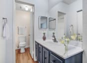 Thumbnail 5 of 16 - a bathroom with a sink and a toilet