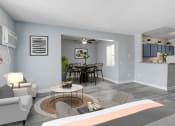 Thumbnail 6 of 16 - a bedroom with a bed and a table with chairs in a room with a kitchen and a