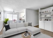 Thumbnail 10 of 61 - a living room with a white couch and a table