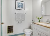 Thumbnail 17 of 35 - a bathroom with a white toilet next to a sink