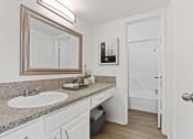 Thumbnail 18 of 20 - a bathroom with a sink and a mirror