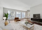 Thumbnail 4 of 20 - a living room with a couch and a tv