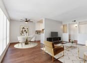 Thumbnail 3 of 20 - a living room with furniture and a ceiling fan
