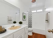 Thumbnail 9 of 20 - a bathroom with a sink and a toilet and a shower