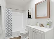 Thumbnail 6 of 8 - a bathroom with a sink toilet and a shower