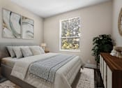 Thumbnail 6 of 26 - A bedroom with a large bed and a painting on the wall.