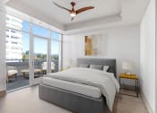 Thumbnail 60 of 95 - a bedroom with a bed and a ceiling fan