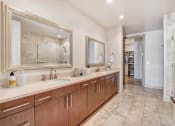 Thumbnail 57 of 95 - a large bathroom with two sinks and a large mirror