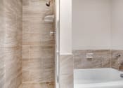Thumbnail 7 of 23 - a bathroom with a shower and a sink