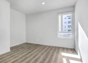 Thumbnail 39 of 42 - an empty room with white walls and a window