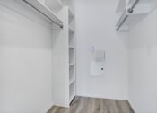 Thumbnail 34 of 42 - an empty room with white walls and shelves