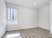Thumbnail 35 of 42 - an empty room with white walls and a window