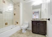 Thumbnail 68 of 88 - a bathroom with a toilet and a tub and a sink