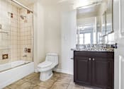 Thumbnail 67 of 88 - a bathroom with a toilet and a shower and a sink