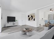 Thumbnail 6 of 23 - a living room with a couch and a coffee table