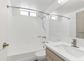 Thumbnail 31 of 94 - a bathroom with a sink toilet and a shower