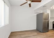 Thumbnail 13 of 94 - a kitchen with a stainless steel refrigerator and a ceiling fan