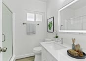 Thumbnail 8 of 23 - a bathroom with a sink and a toilet and a shower