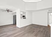 Thumbnail 15 of 94 - an empty living room with white walls and a ceiling fan