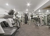 Thumbnail 5 of 10 - a gym with treadmills and other exercise equipment