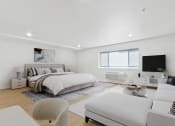 Thumbnail 3 of 45 - a white bedroom with a large bed and a white couch