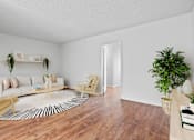 Thumbnail 4 of 22 - an open living room with a couch and a rug