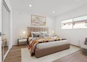 Thumbnail 21 of 32 - a bedroom with a bed and two windows
