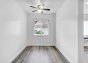 Thumbnail 7 of 73 - an empty room with a window and a ceiling fan