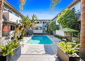 Thumbnail 19 of 25 - the pool is surrounded by palm trees and a pool house