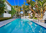 Thumbnail 20 of 25 - the swimming pool at the backyard of a house with a blue pool