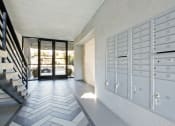 Thumbnail 22 of 24 - a long hallway with white cabinets and a staircase and glass doors