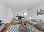 Thumbnail 1 of 34 - a living room with a couch and chairs and a coffee table
