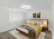 Thumbnail 4 of 8 - a bedroom with a bed and two lamps