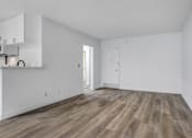 Thumbnail 15 of 20 - a bedroom with hardwood floors and white walls