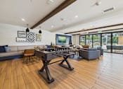 Thumbnail 40 of 40 - A modern kitchen with a wooden floor and a large island.