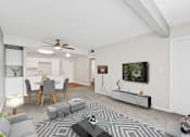 Thumbnail 18 of 40 - a living room with white walls and a ceiling fan