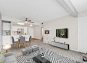 Thumbnail 19 of 40 - our apartments offer a living room with a couch a coffee table and a dining table