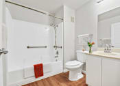 Thumbnail 23 of 40 - a bathroom with a toilet sink and bathtub