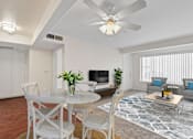 Thumbnail 8 of 40 - a living room with white furniture and a ceiling fan