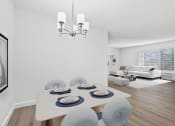 Thumbnail 5 of 40 - a living room and dining room with a table and chairs