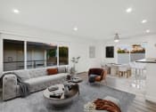 Thumbnail 27 of 135 - a living room with a white couch and a table