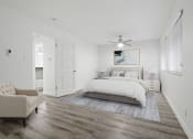 Thumbnail 28 of 135 - a white bedroom with a bed and a ceiling fan