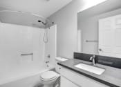 Thumbnail 25 of 62 - a bathroom with a sink toilet and a shower
